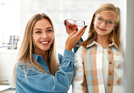Mom and daugther trying on glasses